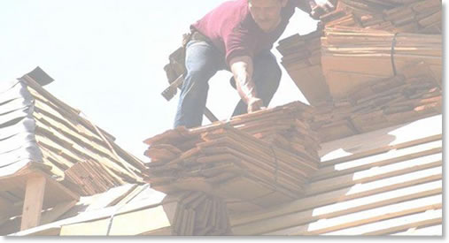 Man on roof with roof tiles